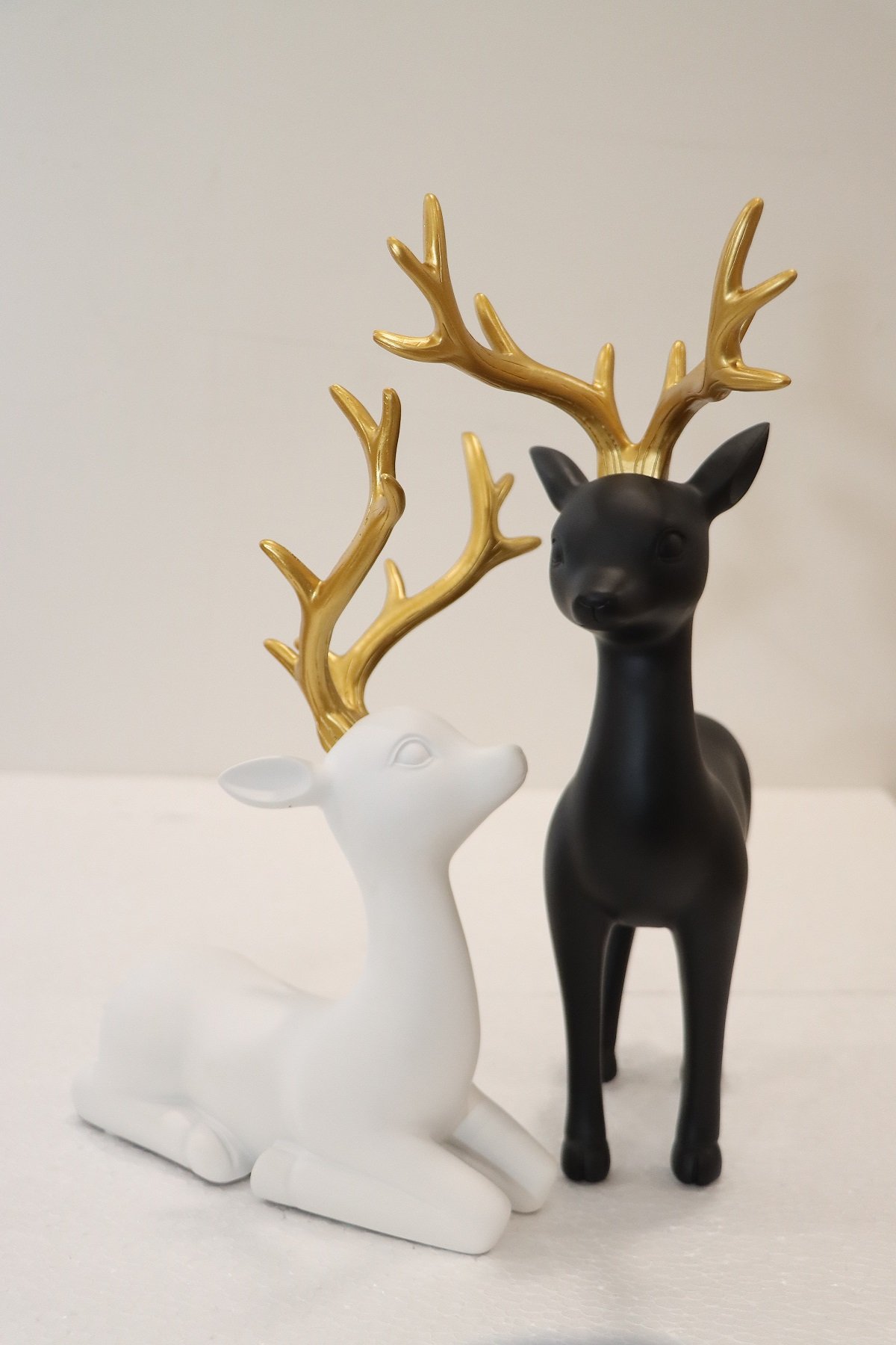 Elegant Gold & WhiteBlack Reindeer Figurines